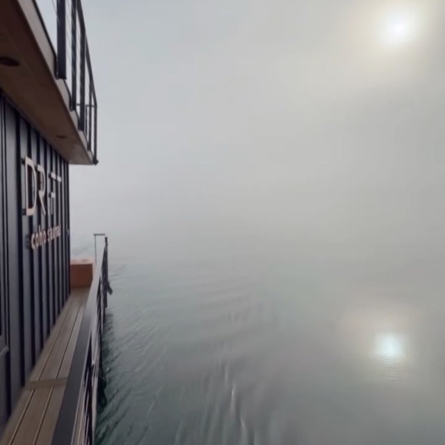 The Drift sauna boat gliding through morning fog on Bellingham Bay